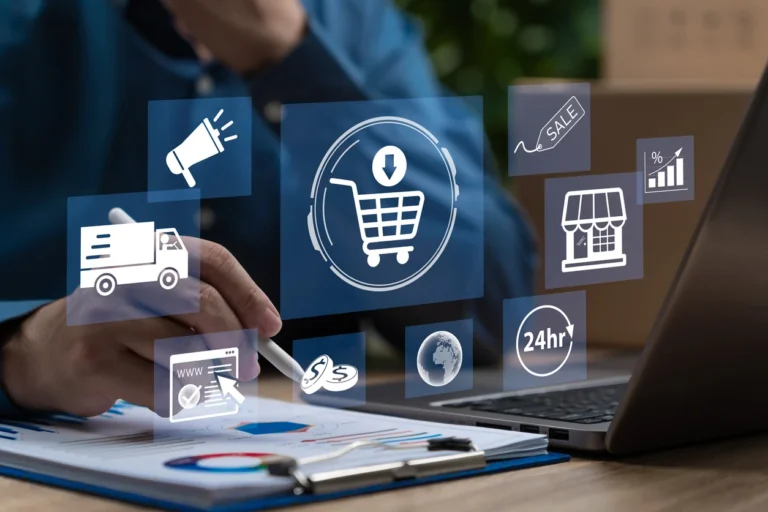 Melhores softwares de pagamento a fornecedores: Pessoa usando laptop em escritório com ícones digitais de pagamento, carrinho de compras e logística, sugerindo sistemas para pagamento a fornecedores